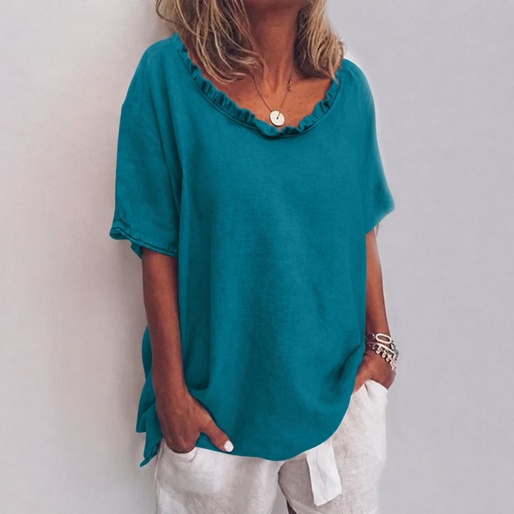 Versatile women's ruffle-neck short-sleeve blouse in a relaxed fit, a stylish choice for summer casual outfits.