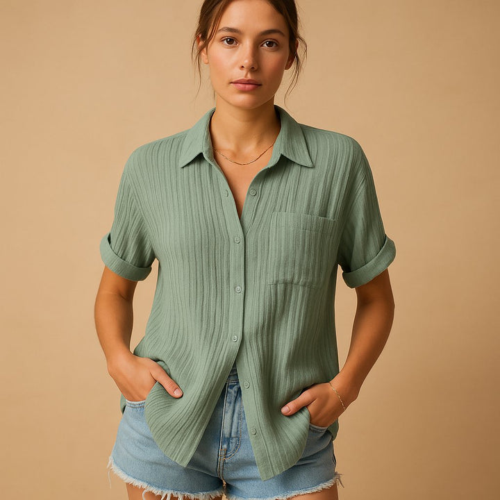 Women's comfortable short sleeve relaxed fit shirt with button-down front, classic collar, and handy chest pocket.