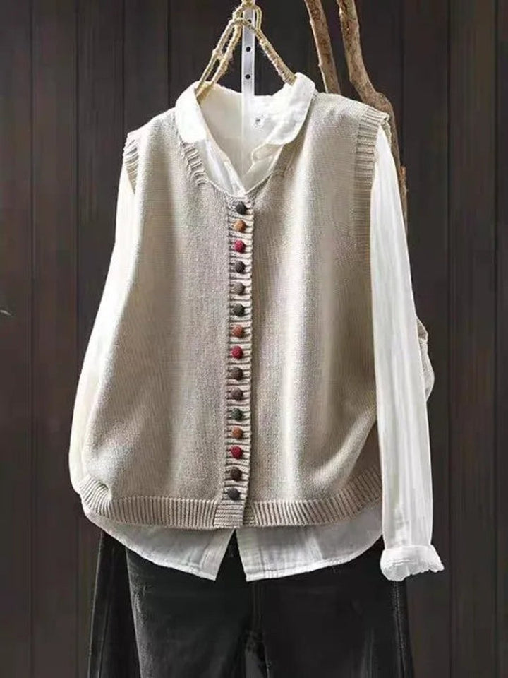 Women's relaxed fit sleeveless vest with button-up front, perfect for casual layering & fall fashion.