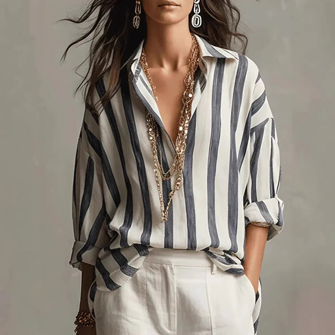 Women's relaxed-fit striped long sleeve blouse, perfect for smart casual or everyday elegant wear. Versatile collared top.