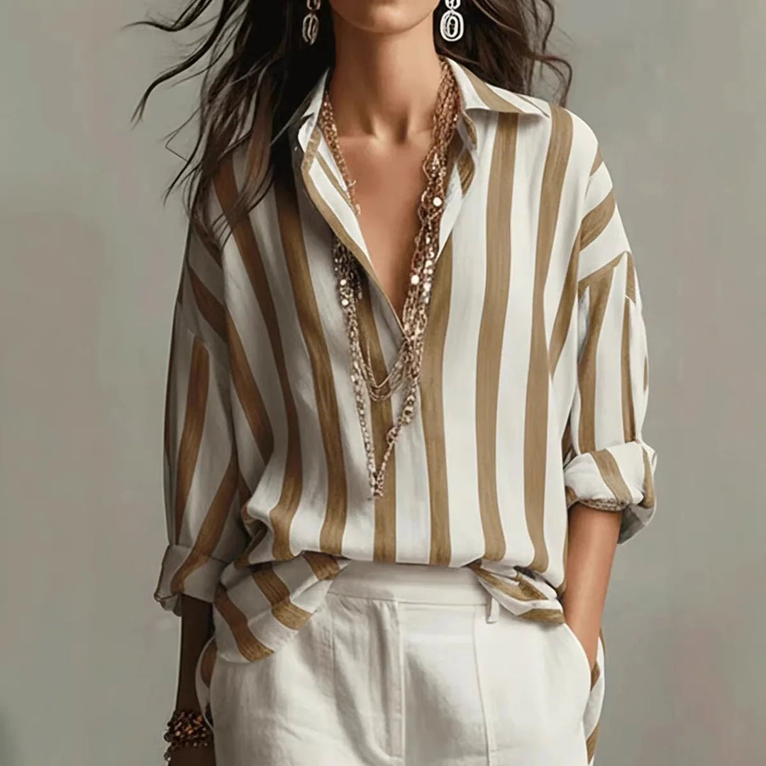Elegant women's striped long sleeve blouse with a relaxed fit. Ideal for versatile, smart casual everyday fashion.