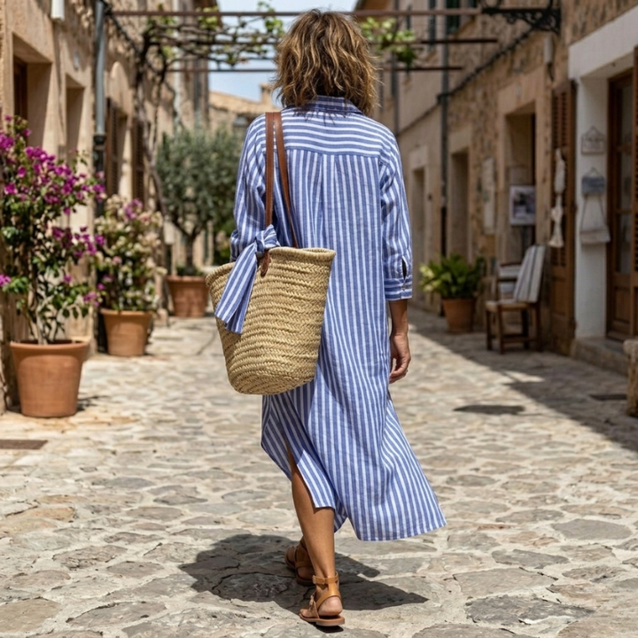 Stylish women's striped shirt dress with a relaxed fit, featuring a classic button front for elegant casual daywear.