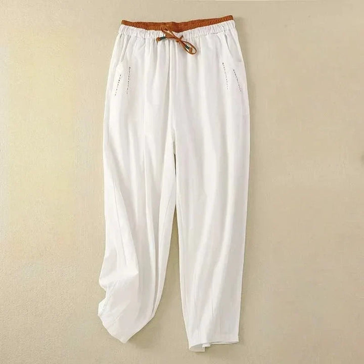 Women's relaxed fit summer pants with wide leg and elasticated drawstring waist for comfortable casual wear.