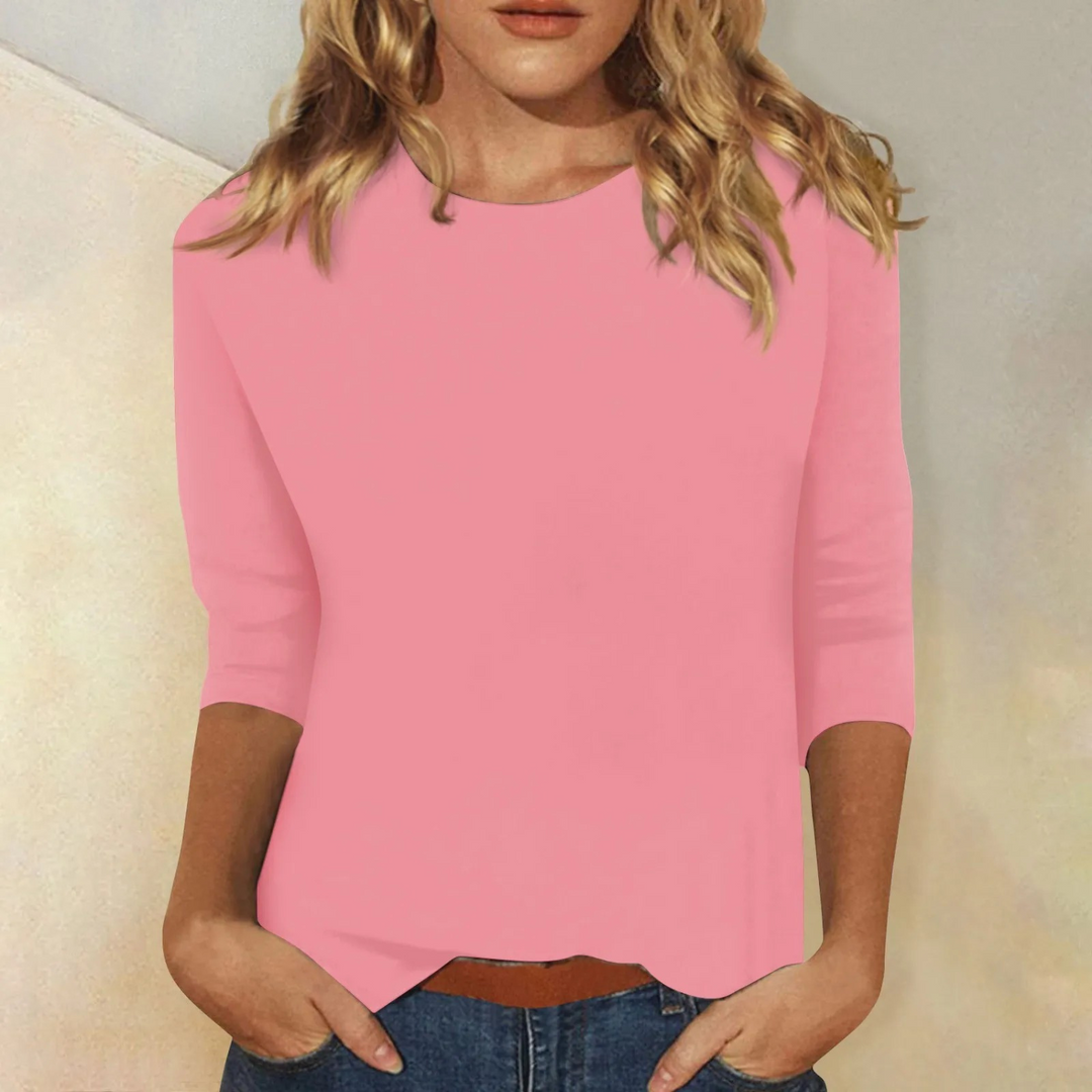Chic women's three-quarter sleeve top, relaxed fit for versatile everyday wear.