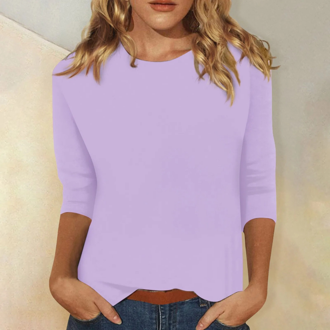 Round neck women's top, relaxed fit three-quarter sleeve, ideal for casual everyday wear.