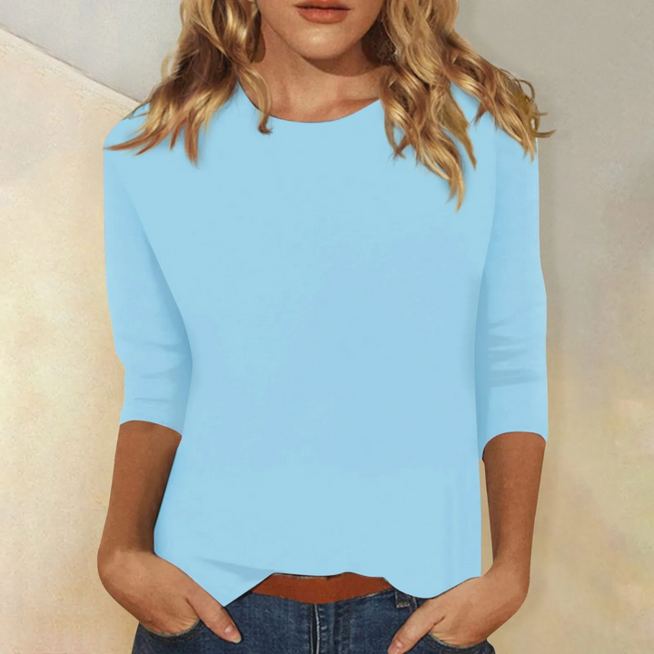 Versatile women's three-quarter sleeve top, relaxed fit for chic casual and summer styles.