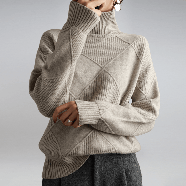 Stylish women's relaxed fit turtleneck sweater, perfect for versatile and elegant winter wear.