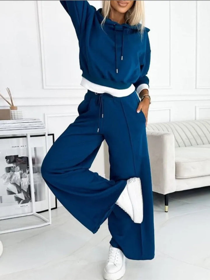 Gray women's two-piece outfit with a relaxed fit, a versatile matching set for casual and comfortable wear.