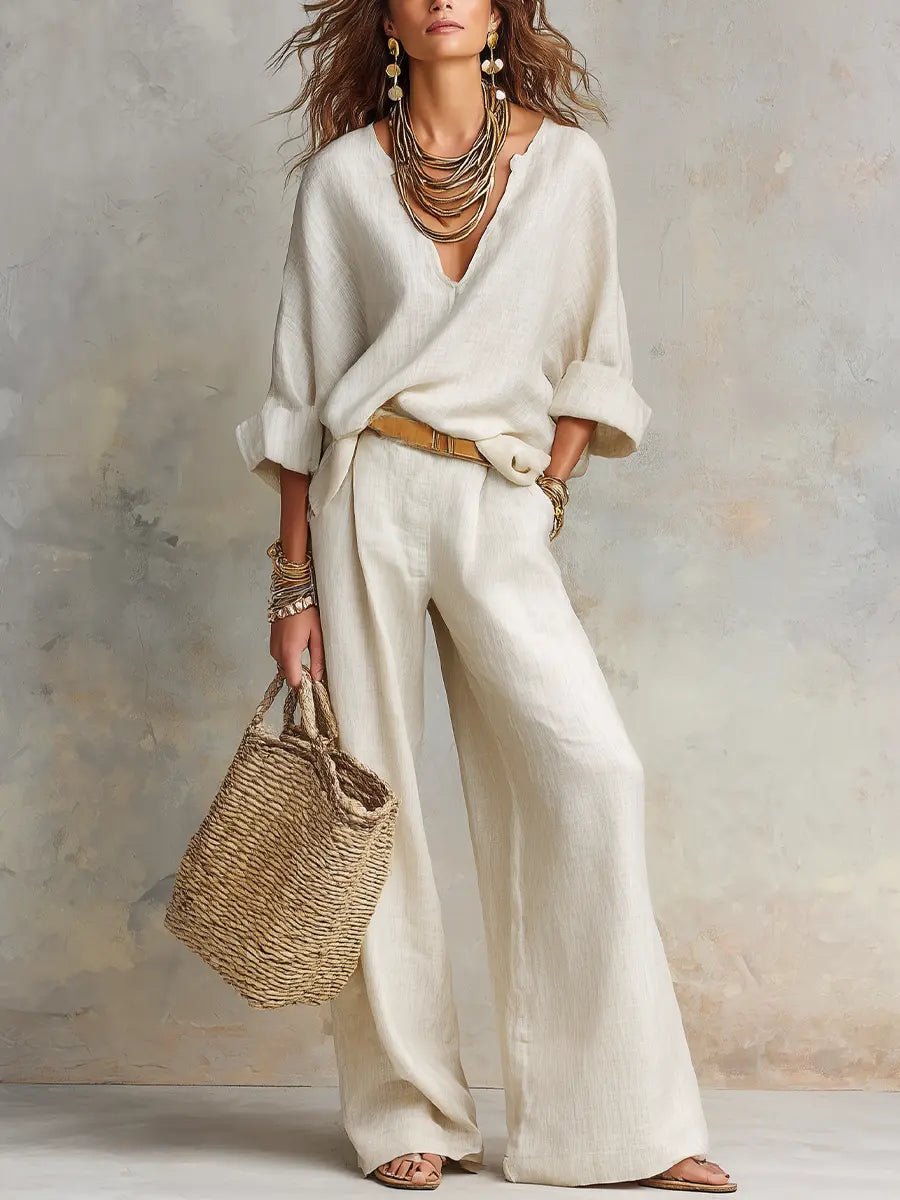 Women's relaxed-fit two-piece resort set with flowing pants & V-neck top, perfect for elegant comfort.
