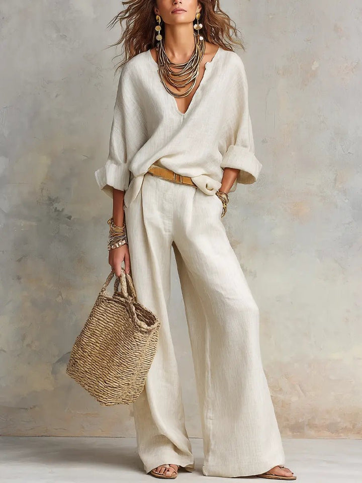 Women's relaxed-fit two-piece resort set with flowing pants & V-neck top, perfect for elegant comfort.