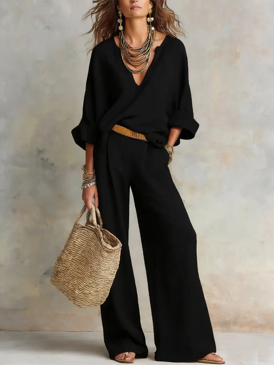 Chic women's two-piece resort set for vacation style, featuring a relaxed fit top and flowing wide-leg pants.