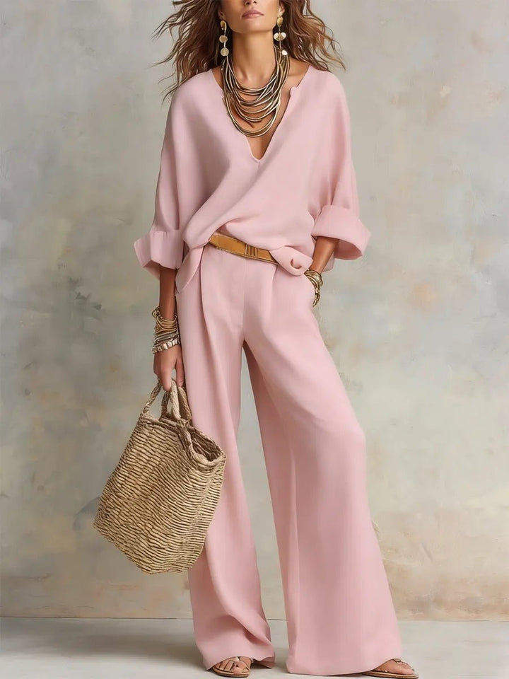 Women's V-neck top and flowing wide-leg pants in a relaxed-fit two-piece resort set for summer fashion.