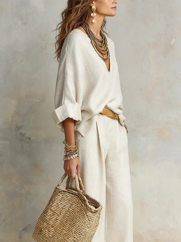 Elegant women's relaxed resort two-piece set for vacation; includes a stylish top and comfortable flowing pants.