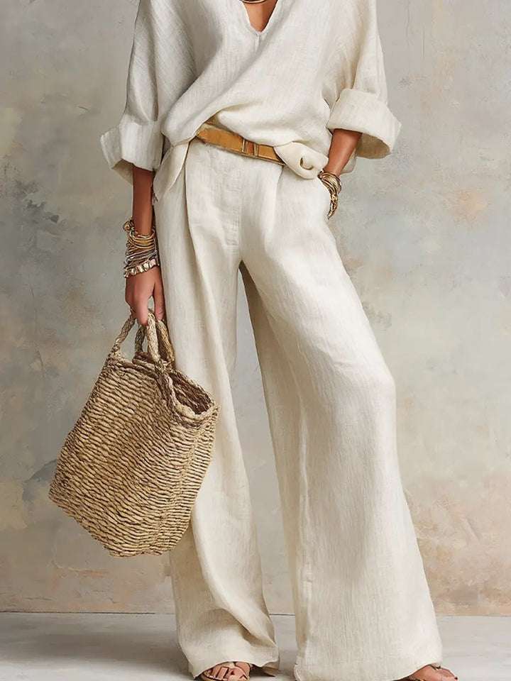 Women's relaxed-fit two-piece resort set with a v-neck top and flowing pants, great for summer vacation style.