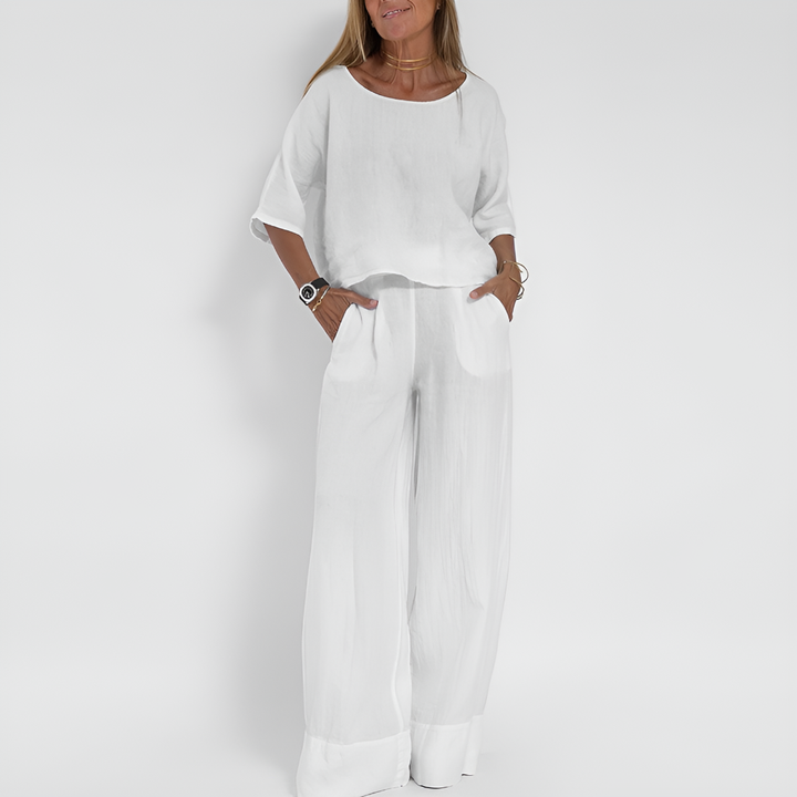 Comfortable women's loungewear two-piece set: relaxed short sleeve top & wide leg pants, ideal for home or casual outings.
