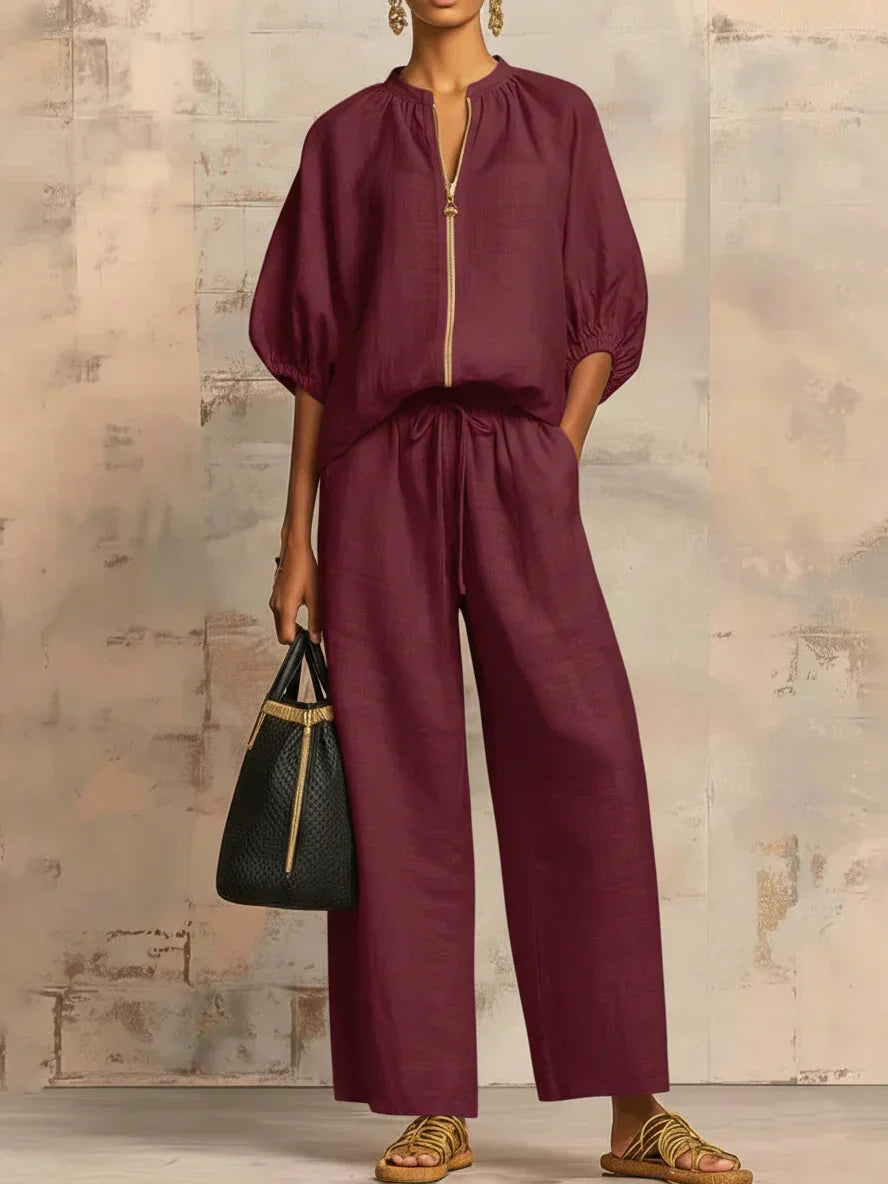 Women's relaxed fit two-piece set featuring a button-up shirt and wide-leg trousers, perfect for casual summer wear.