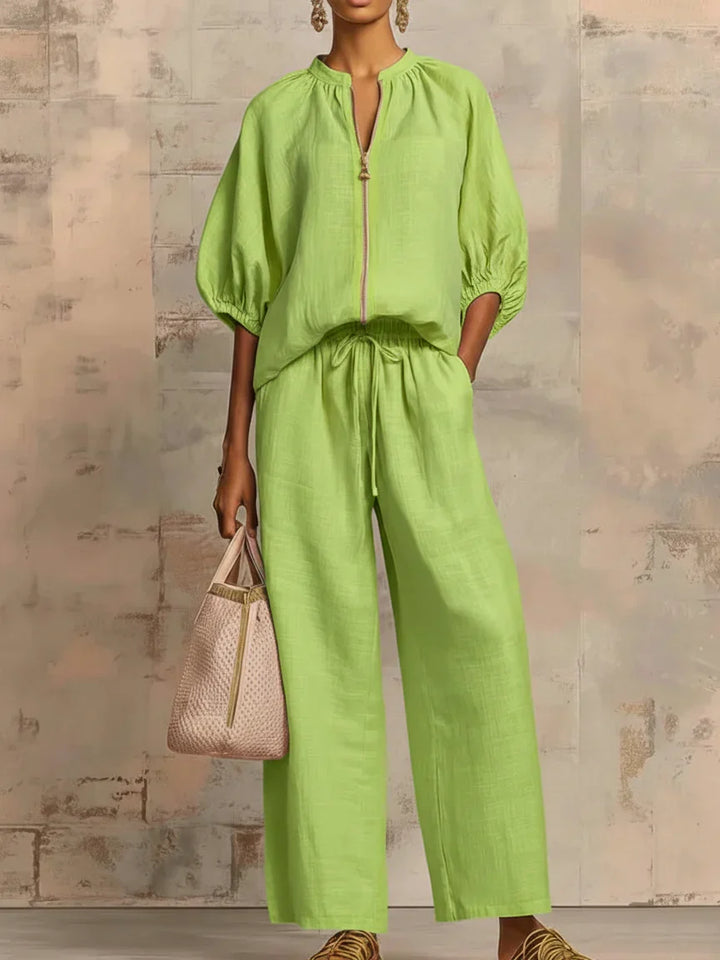 Comfortable women's two-piece set with a relaxed button-up shirt and stylish wide-leg trousers for versatile everyday chic.