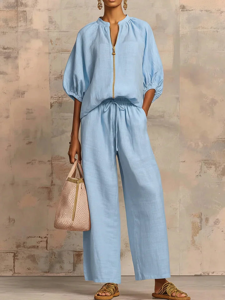 Women's two-piece set featuring a relaxed button-up shirt with long sleeves & comfortable wide-leg trousers.