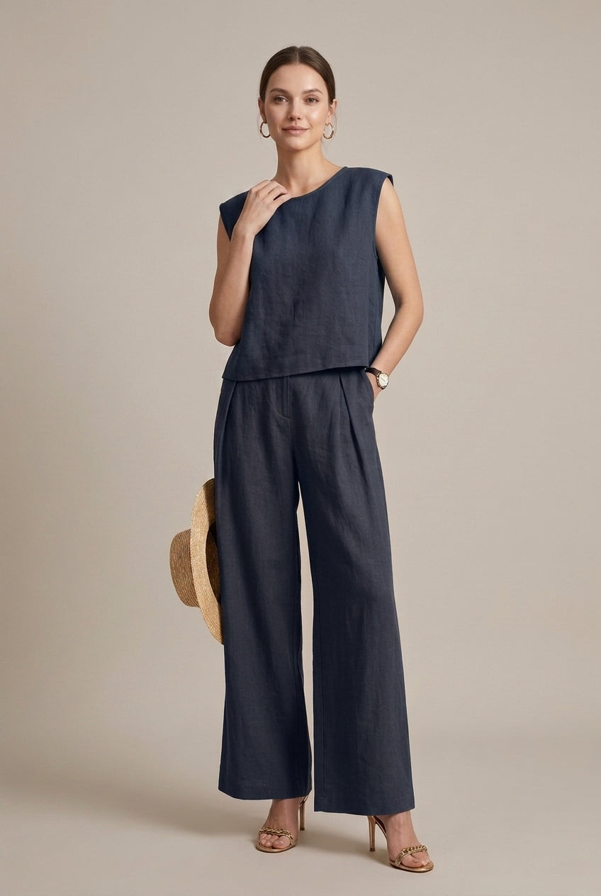Model in a chic women's relaxed fit two-piece outfit. Sleeveless top & wide-leg pants for comfortable casual style.