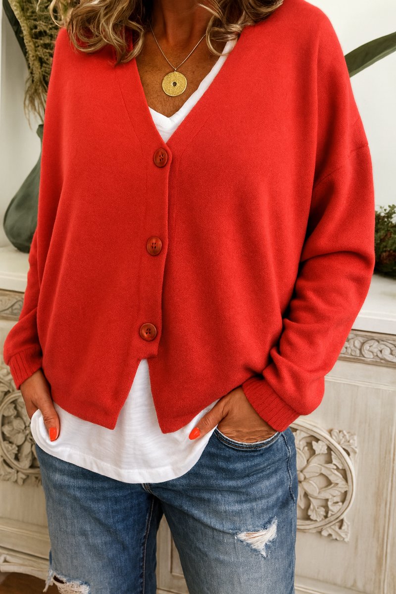 Long sleeve women's V-neck button-front cardigan in a relaxed fit. Ideal for comfortable casual fashion.
