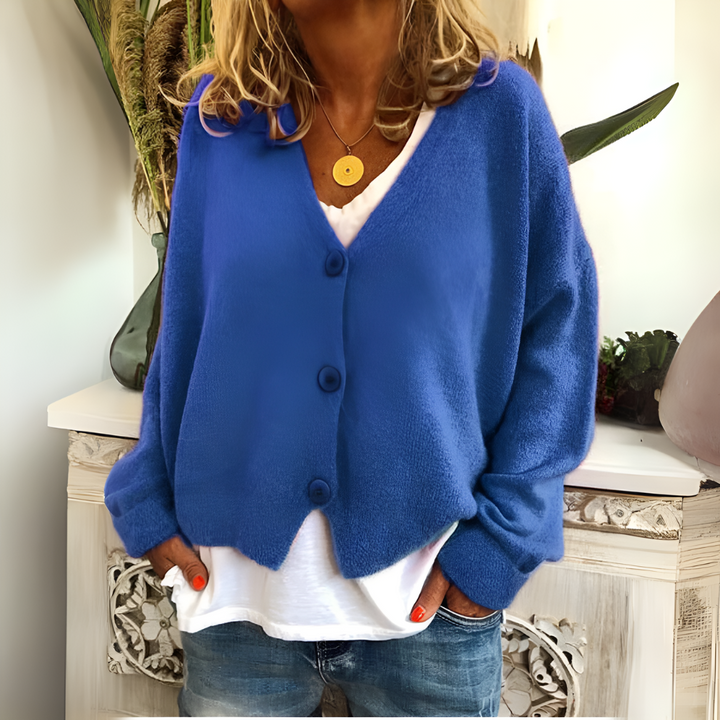 Relaxed fit women's v-neck cardigan, a cozy button-front layering top for comfortable autumn wear.