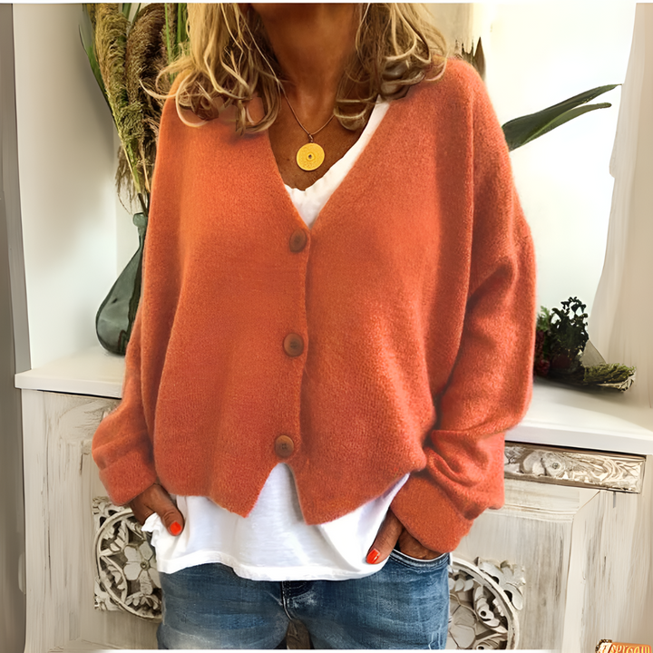 Fashionable women's v-neck relaxed fit cardigan, a versatile button-front sweater for casual everyday style.