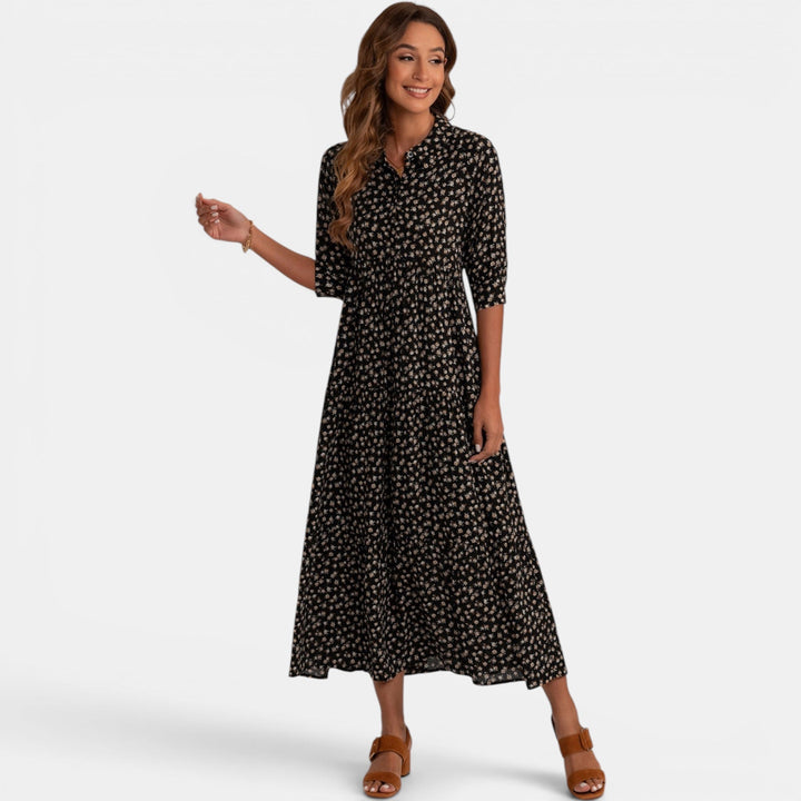 Women's relaxed fit V-neck maxi dress with vibrant floral print, comfortable fabric detail.