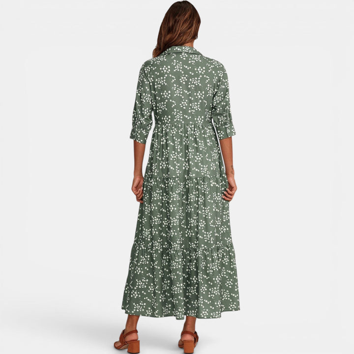 Casual elegant women's floral maxi dress with half sleeves, styled for summer comfort.