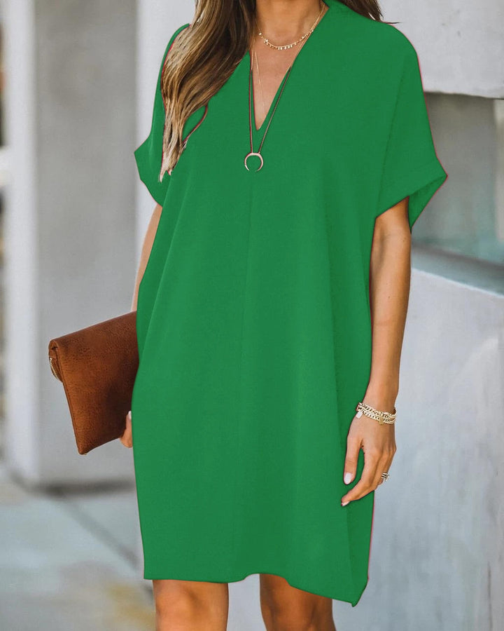 Relaxed fit women's V-neck tunic mini dress. Short sleeve, loose style, great for casual summer wear.