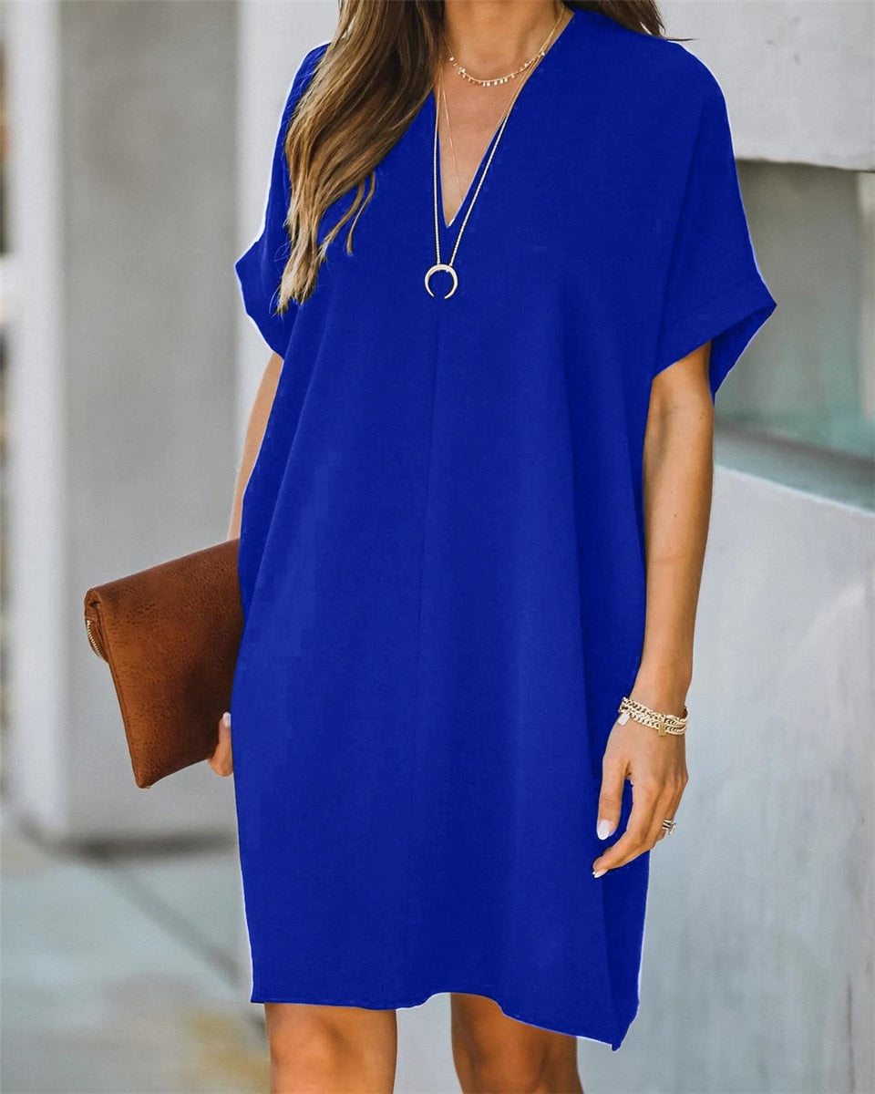 Effortless women's V-neck tunic dress, a relaxed, loose fit mini dress for casual summer or beach wear.