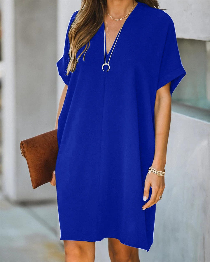 Effortless women's V-neck tunic dress, a relaxed, loose fit mini dress for casual summer or beach wear.