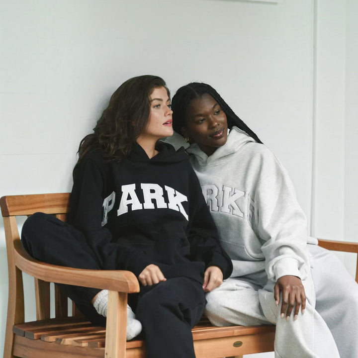 Relaxed fit women's varsity pullover hoodie, cozy and comfortable casual wear.