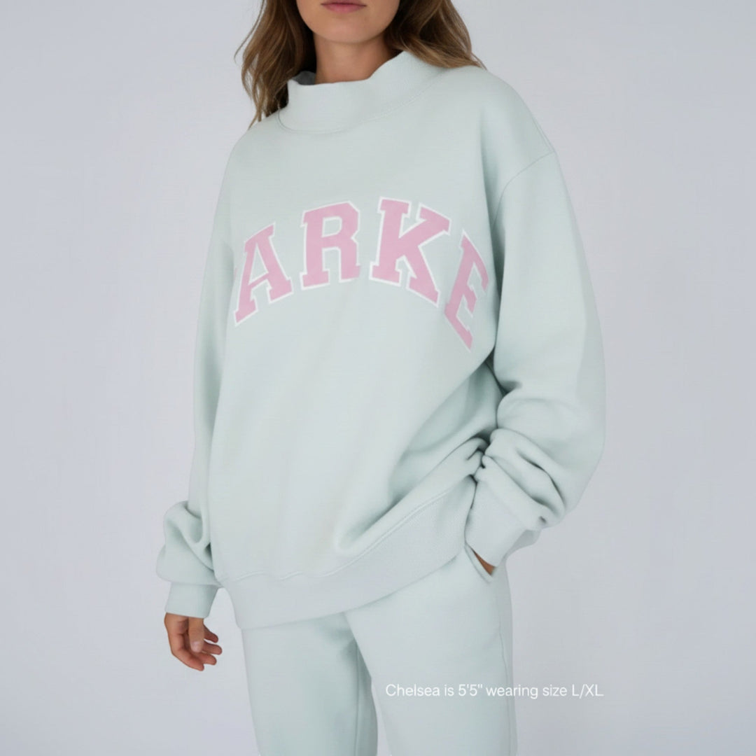 Casual oversized women's varsity hoodie, relaxed fit for cozy loungewear.