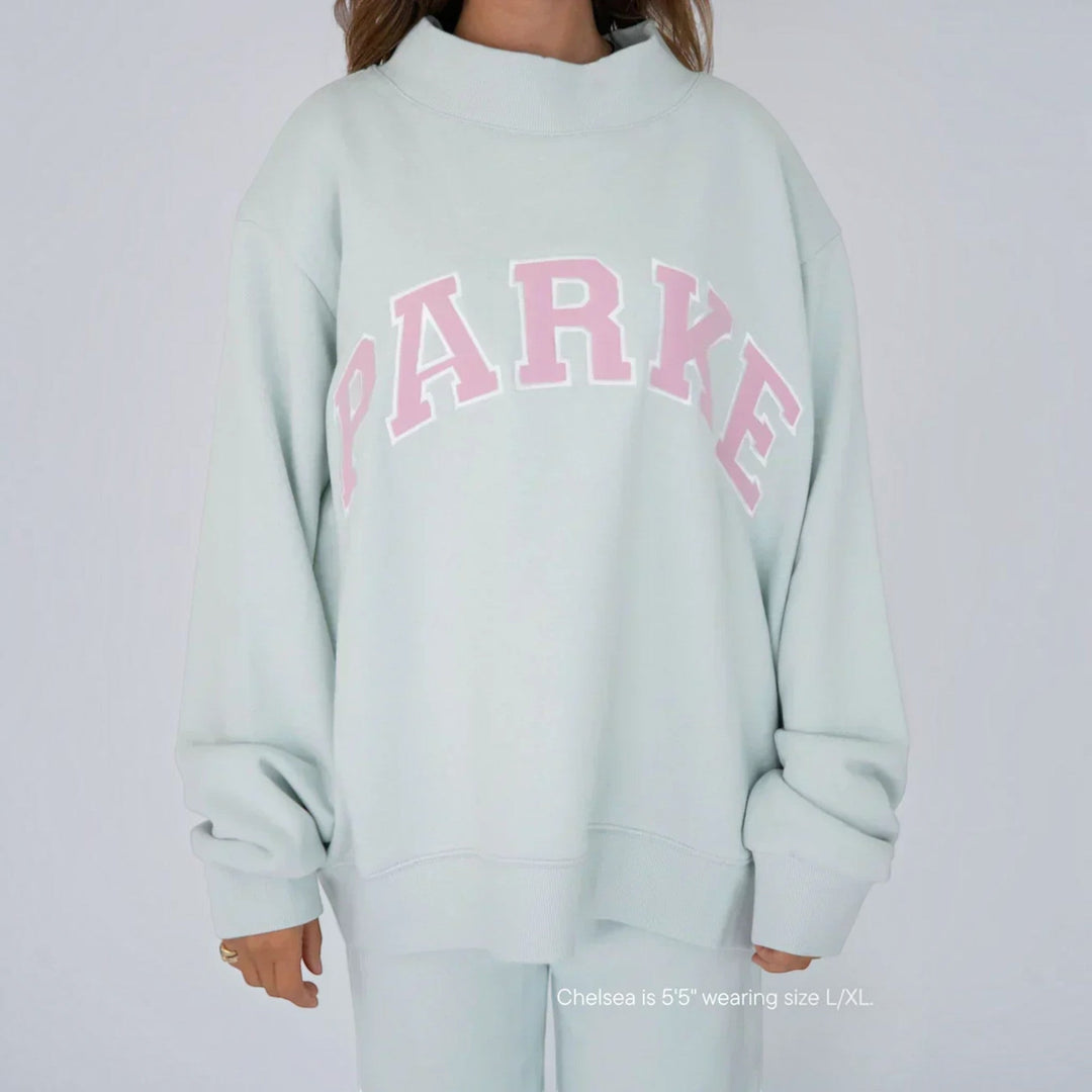 Cozy women's oversized varsity hoodie, perfect for comfortable loungewear.
