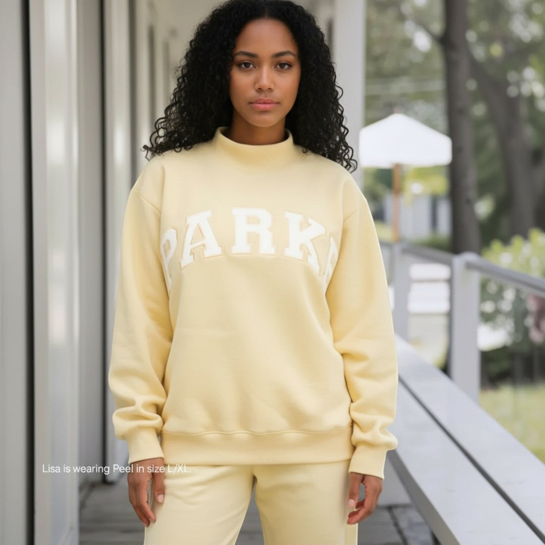 Varsity style women's relaxed fit hoodie, a cozy pullover for loungewear.