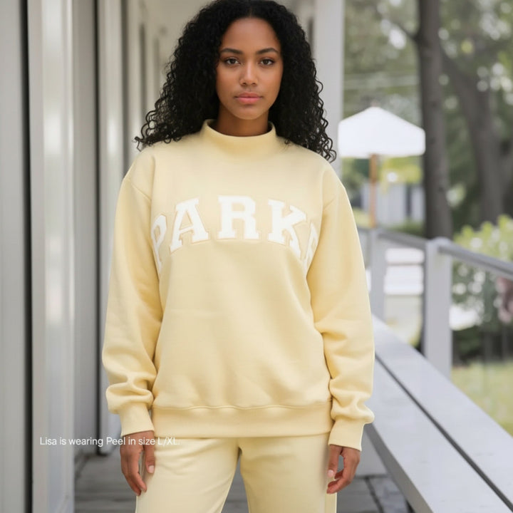 Varsity style women's relaxed fit hoodie, a cozy pullover for loungewear.