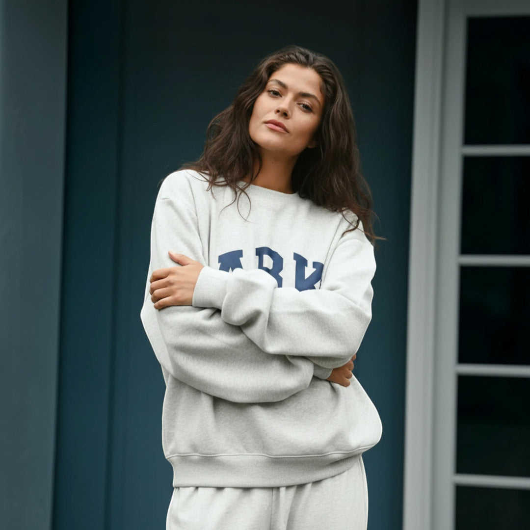 Oversized women's relaxed fit varsity pullover, great for everyday comfort.