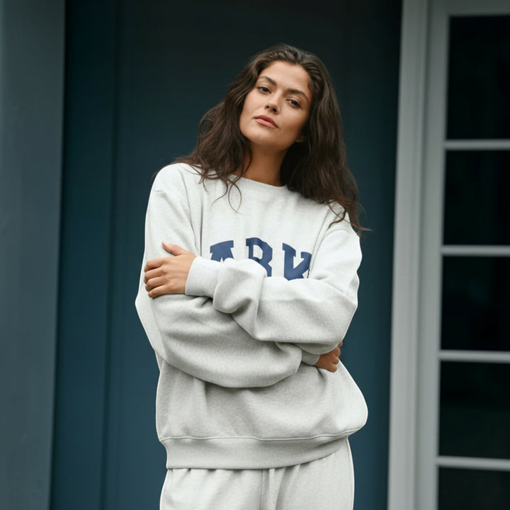 Oversized women's relaxed fit varsity pullover, great for everyday comfort.