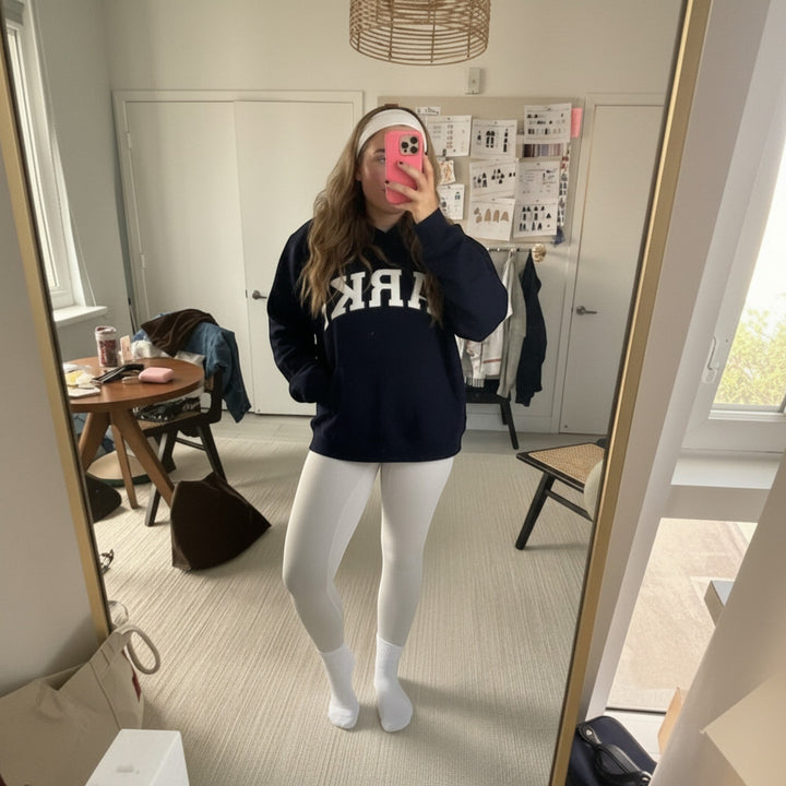 Cozy relaxed fit women's varsity sweater, ideal for casual everyday style.