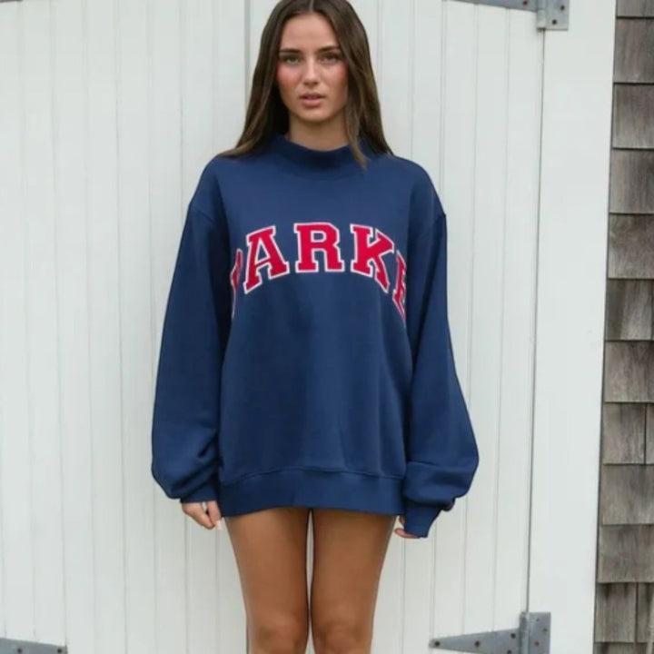 Chic collegiate women's relaxed fit hoodie, stylish for casual comfort.