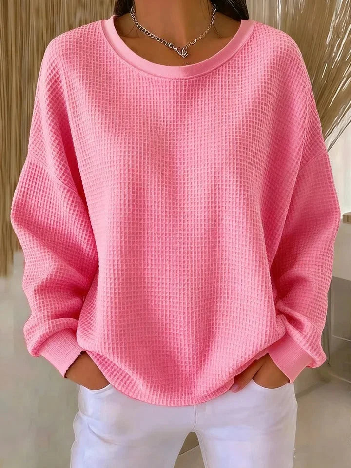 Comfortable women's relaxed fit long sleeve waffle knit sweater, versatile for winter fashion.