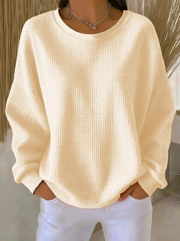 Versatile women's relaxed fit sweater. Waffle knit long sleeve, perfect for casual winter fashion.