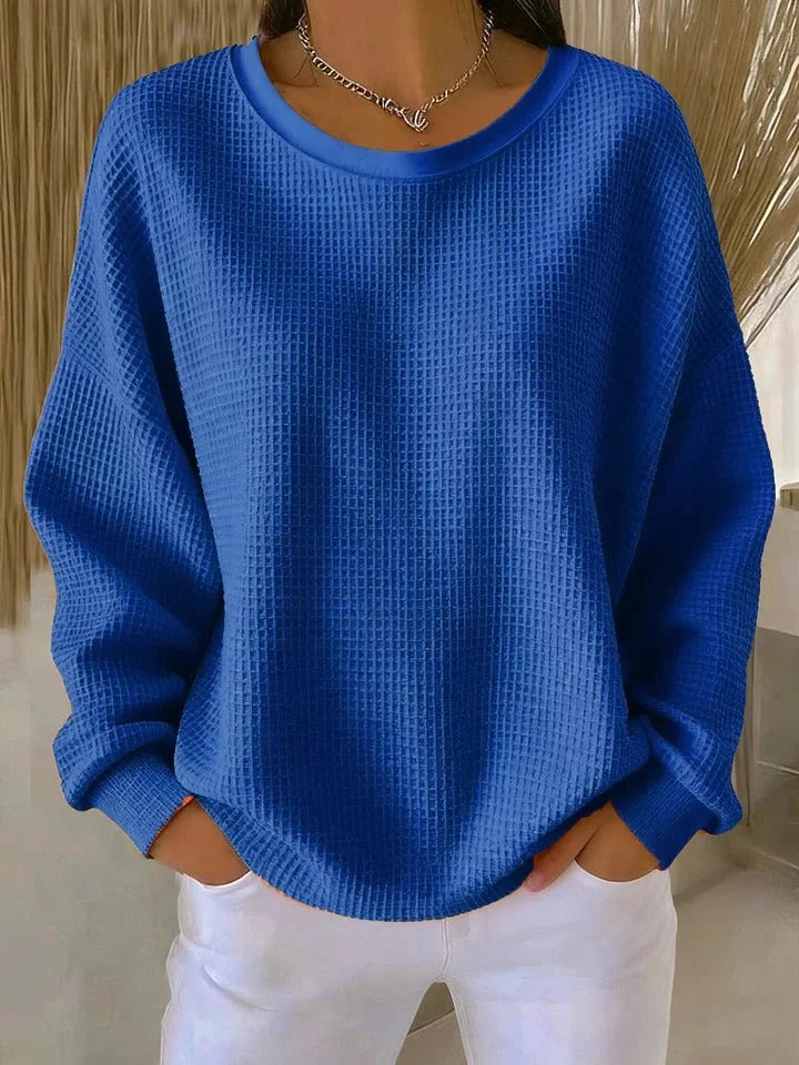 Cozy women's waffle knit long sleeve sweater. Relaxed fit for comfortable everyday casual wear.