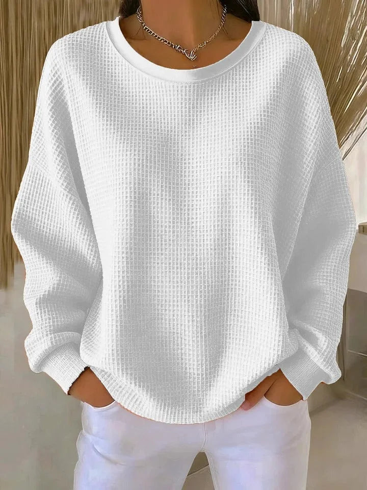 Women's relaxed fit waffle knit long sleeve sweater. Stylish & comfortable casual knit top.