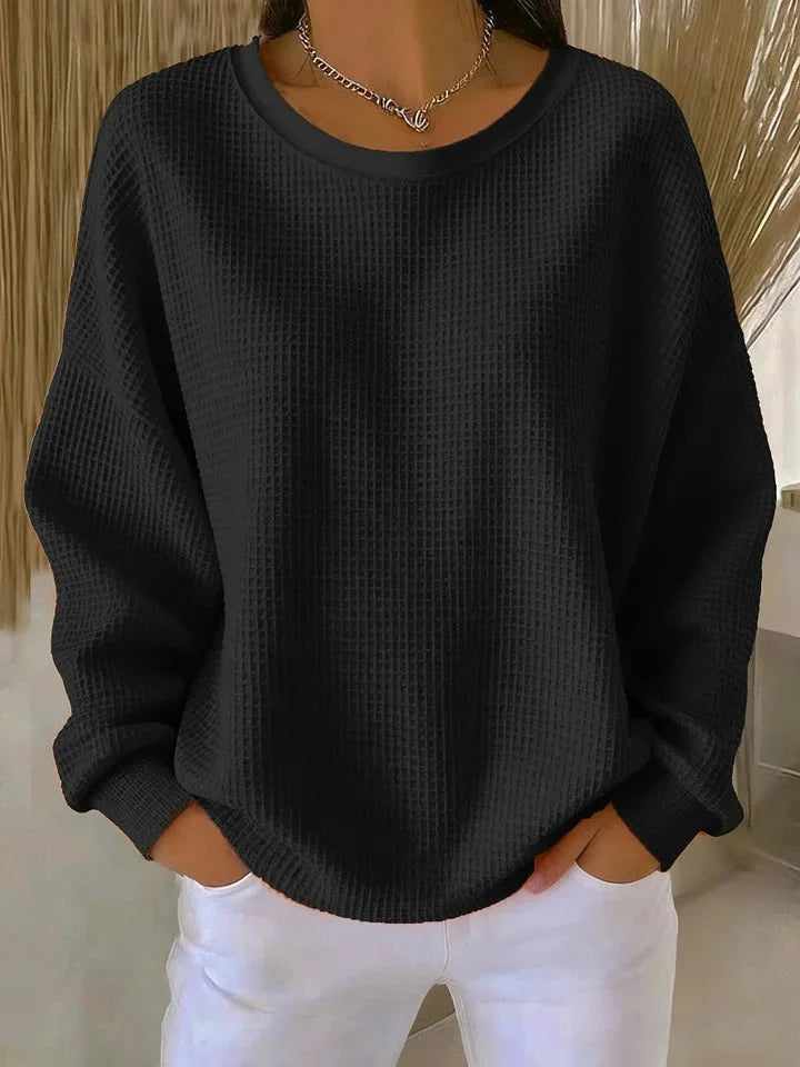 Everyday women's long sleeve waffle knit sweater. Relaxed fit for cozy, versatile winter fashion.