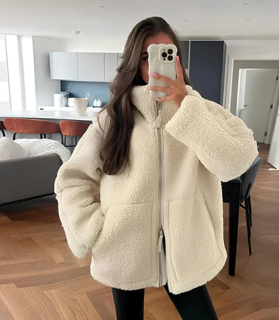 Women's relaxed fit zip-up jacket. Cozy & stylish outerwear for winter fashion. High neck design.