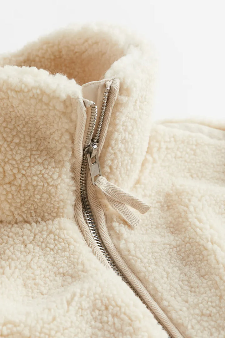Beige women's relaxed fit zip-up jacket, perfect for cozy winter fashion & casual outerwear.