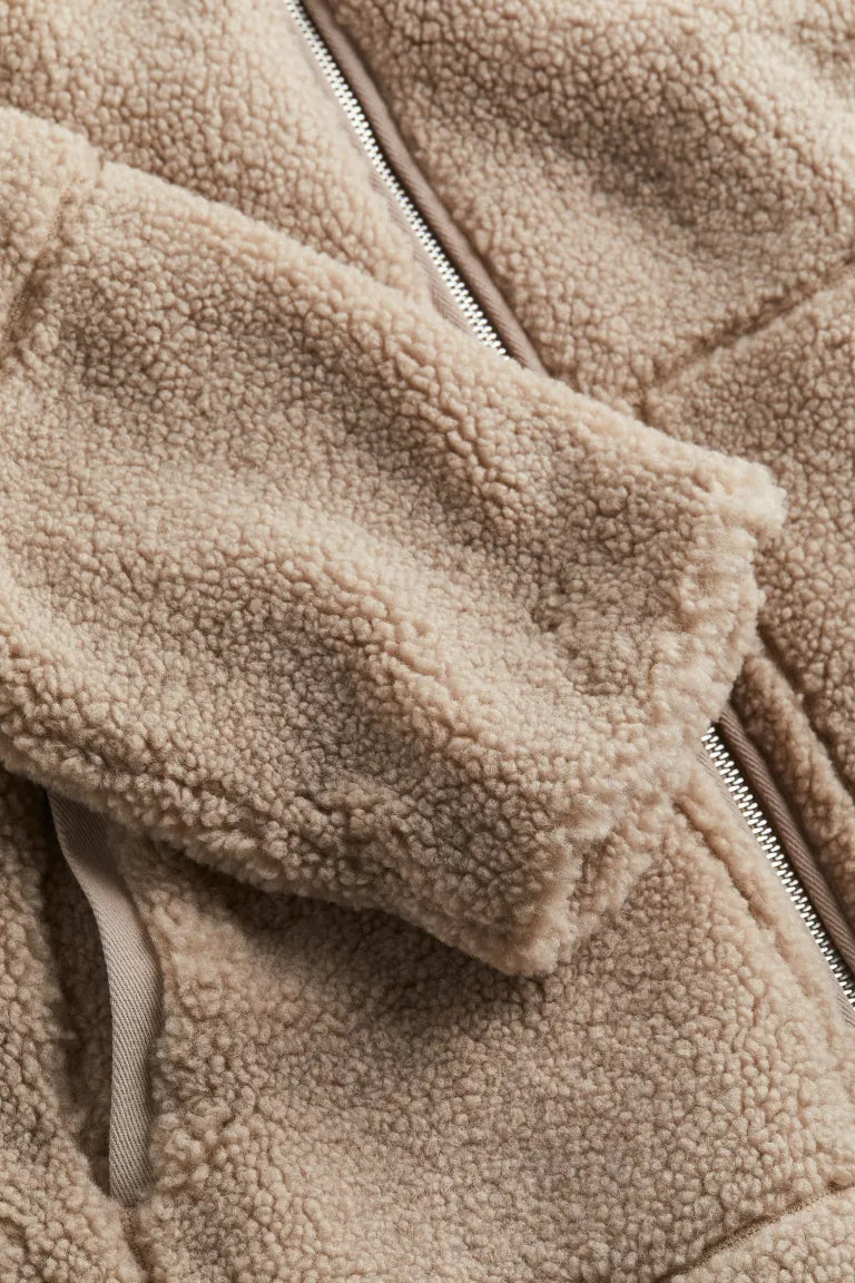 Bronze women's cozy zip-up jacket with a relaxed fit & high neck. Warm casual outerwear for winter.