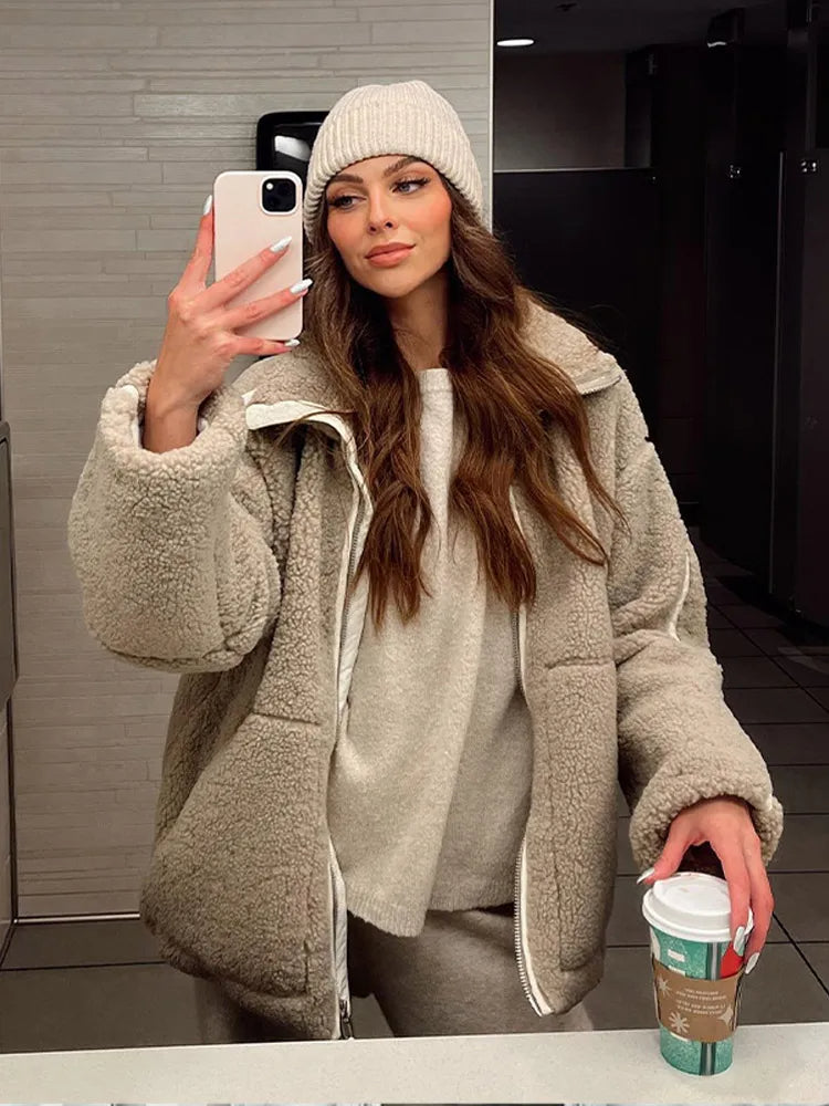 Women's warm, relaxed fit zip-up jacket. Versatile high neck outerwear for casual winter fashion.