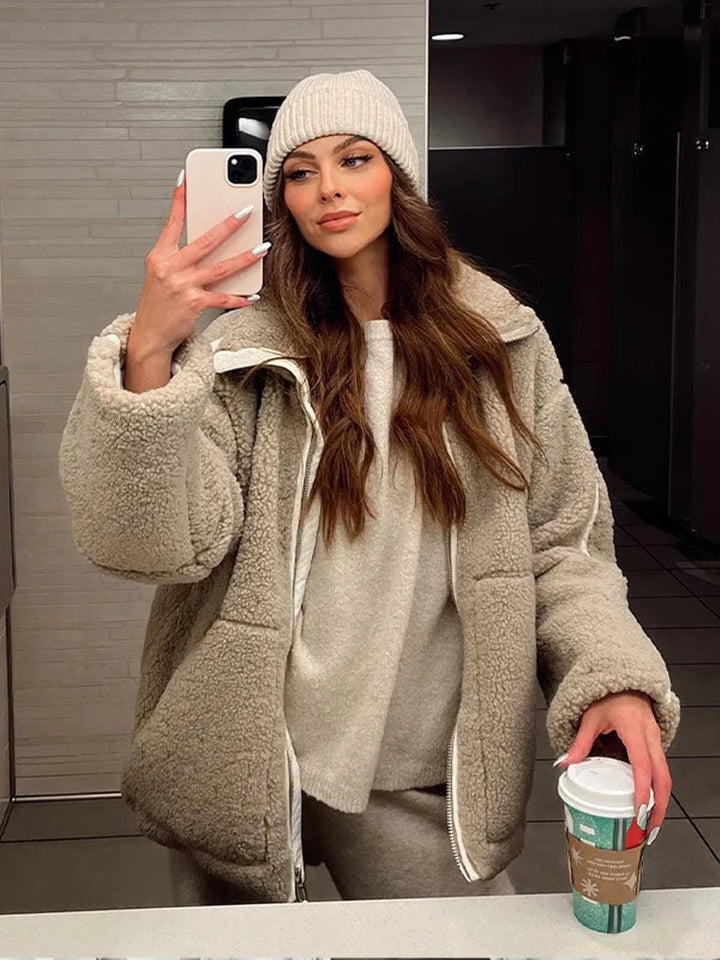 Women's warm, relaxed fit zip-up jacket. Versatile high neck outerwear for casual winter fashion.